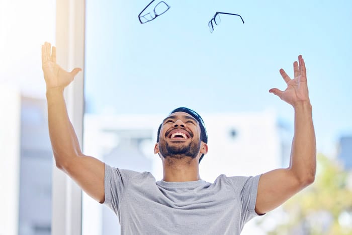 Man getting rid of glasses after LASIK surgery.